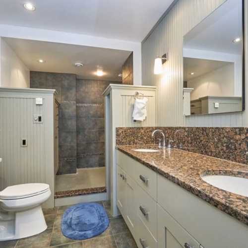 Bathroom #1: full bathroom with shower, en suite to bedroom #1 on the main floor